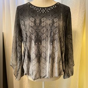 Alfani PL women’s blouse with embellishments along neckline.